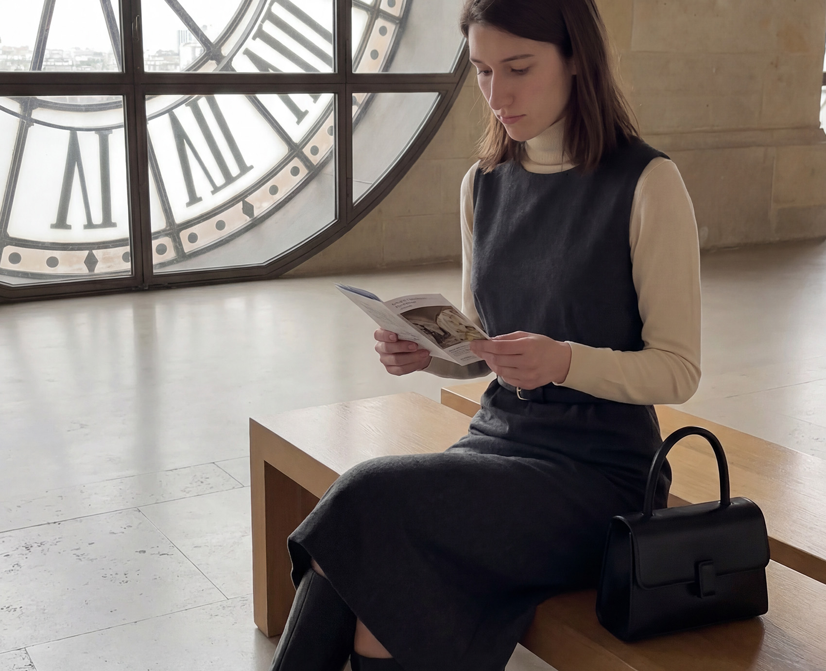 Reading beneath the Musée d'Orsay clock